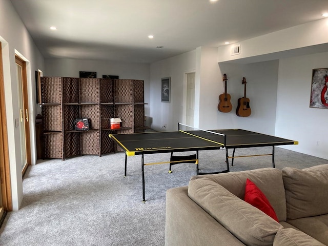 recreation room featuring light colored carpet