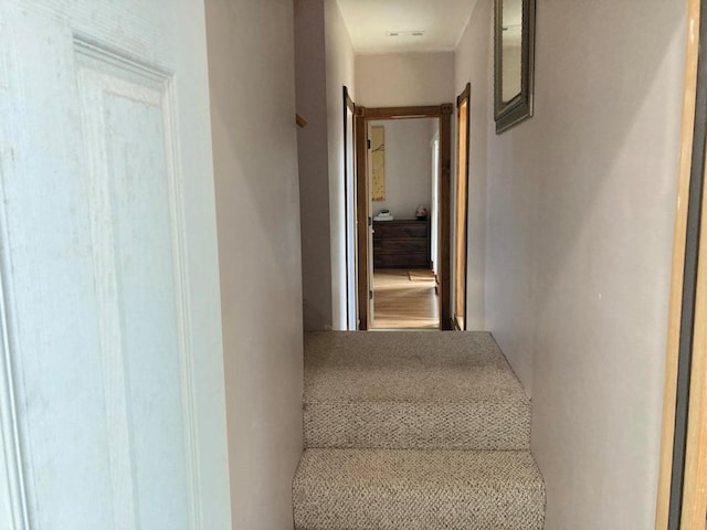 staircase featuring hardwood / wood-style flooring