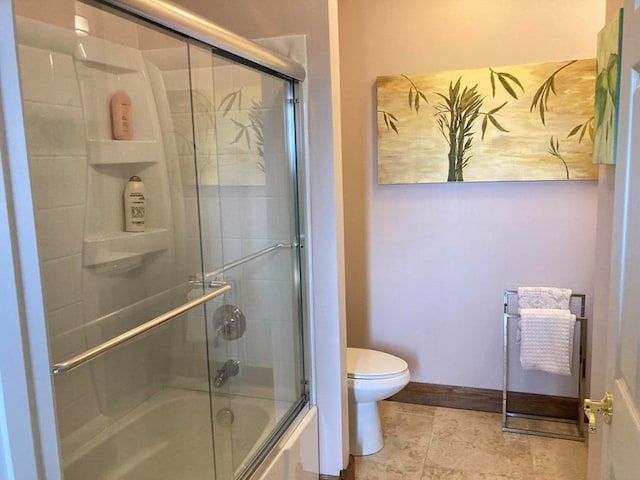 bathroom with combined bath / shower with glass door, toilet, and tile flooring