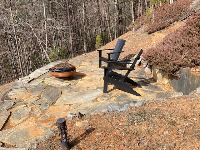 view of terrace with a fire pit