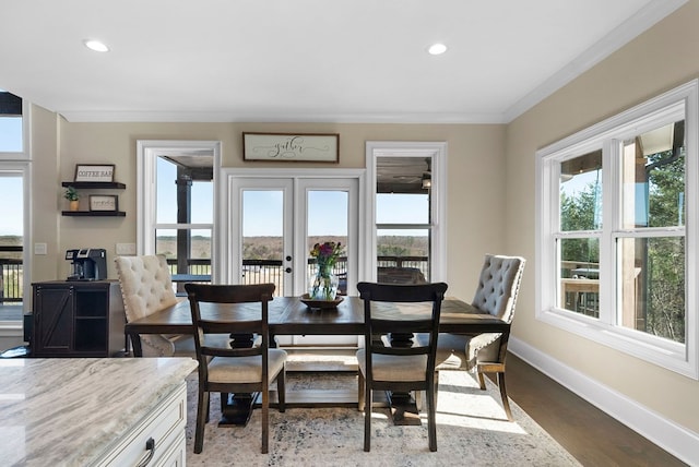 dining area with dark wood-style floors, recessed lighting, french doors, crown molding, and baseboards