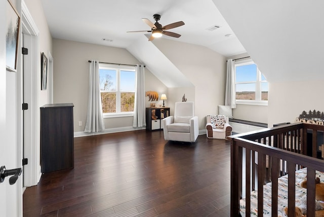 bedroom featuring visible vents, multiple windows, lofted ceiling, and dark wood-style flooring