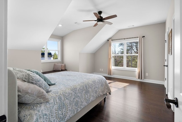 bedroom featuring dark wood-style floors, baseboards, visible vents, lofted ceiling, and ceiling fan