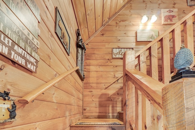 stairs with wood walls