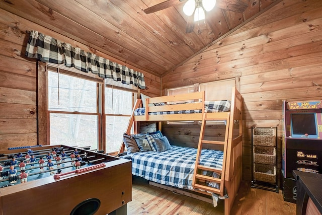 bedroom with lofted ceiling, wood finished floors, and wooden ceiling