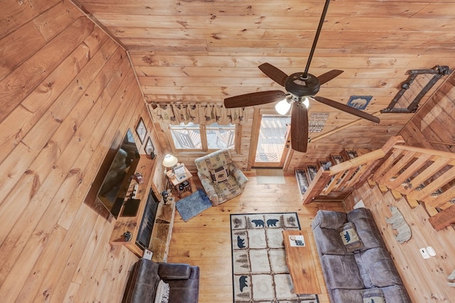 unfurnished living room featuring a ceiling fan