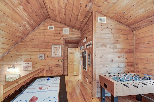 playroom with light wood-type flooring, lofted ceiling, and wood ceiling