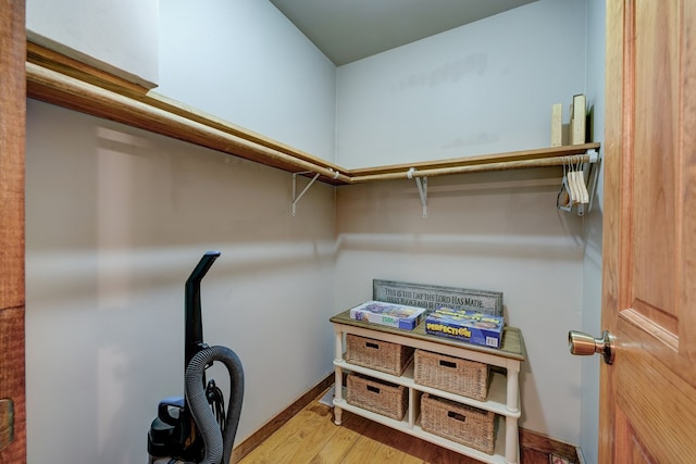 spacious closet featuring wood finished floors