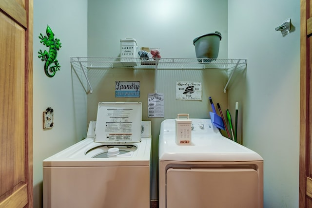 laundry room with independent washer and dryer and laundry area