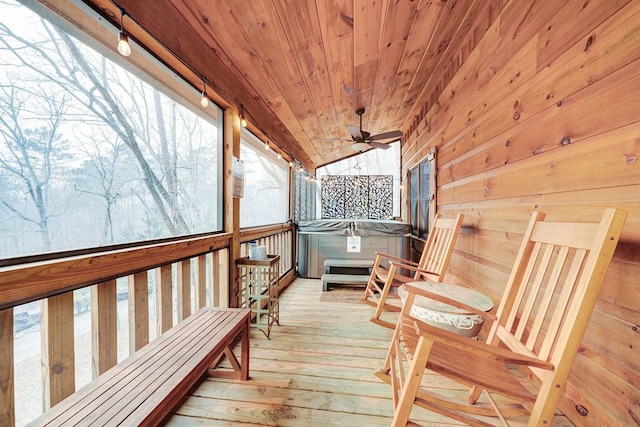 wooden terrace with a hot tub and ceiling fan