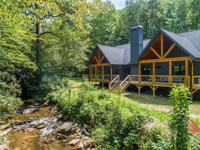 back of house with a wooden deck