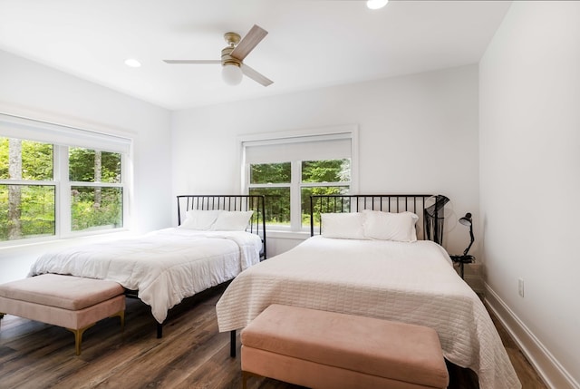 bedroom featuring ceiling fan and dark hardwood / wood-style flooring