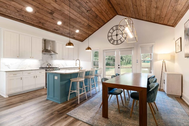 dining room with french doors, dark hardwood / wood-style flooring, high vaulted ceiling, and wooden ceiling