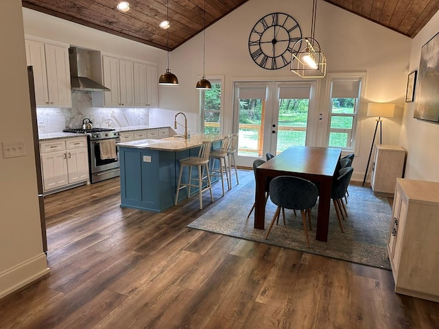 dining area with sink, wood ceiling, dark hardwood / wood-style floors, and french doors