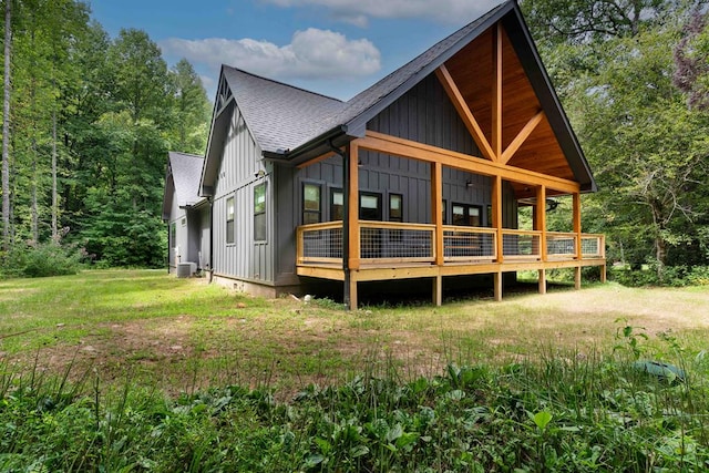 back of house with a lawn