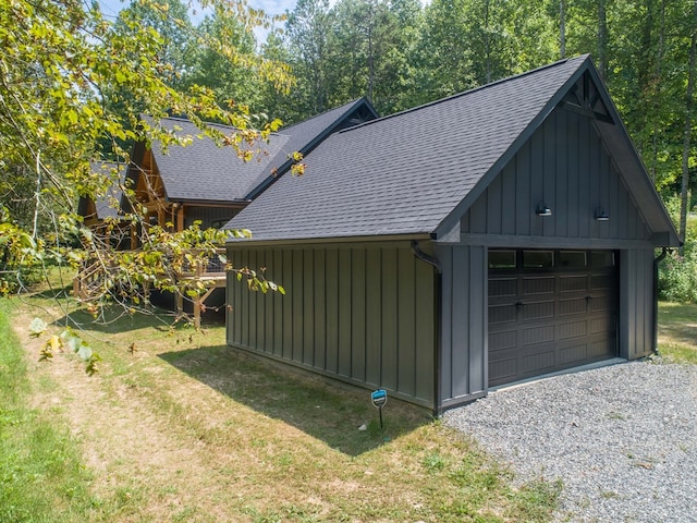 garage featuring a lawn