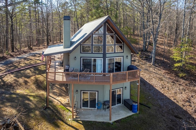 back of house with a patio