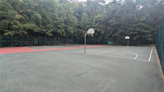 view of basketball court featuring tennis court