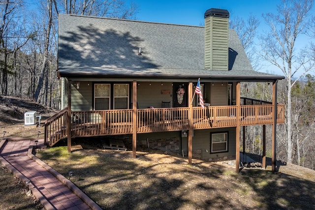 back of property featuring a deck