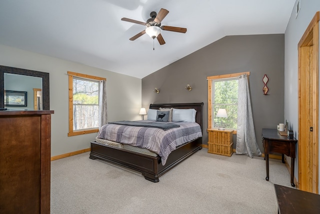 bedroom featuring multiple windows, baseboards, carpet, and vaulted ceiling