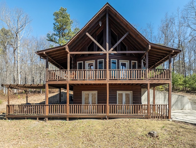 view of front of property featuring french doors and a wooden deck