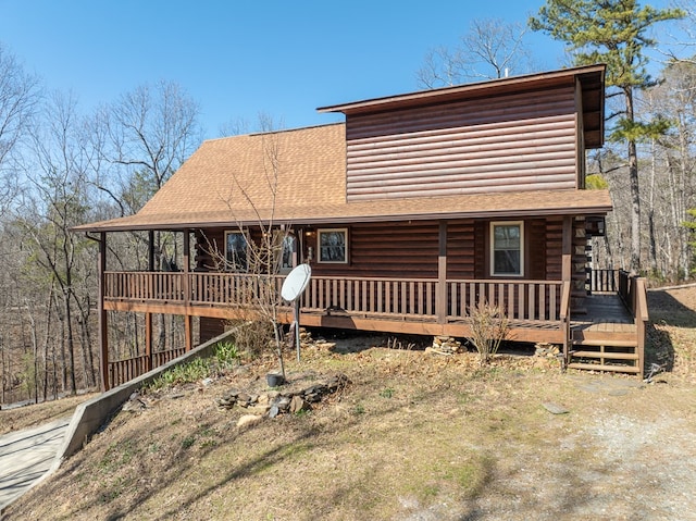 view of front of house with a shingled roof