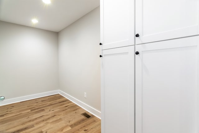 hallway with light wood-type flooring