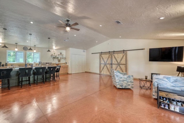 1529 Cedar View Ln, Hiawassee, GA 30546 - living room with lofted ceiling, finished concrete flooring, a ceiling fan, and a textured ceiling