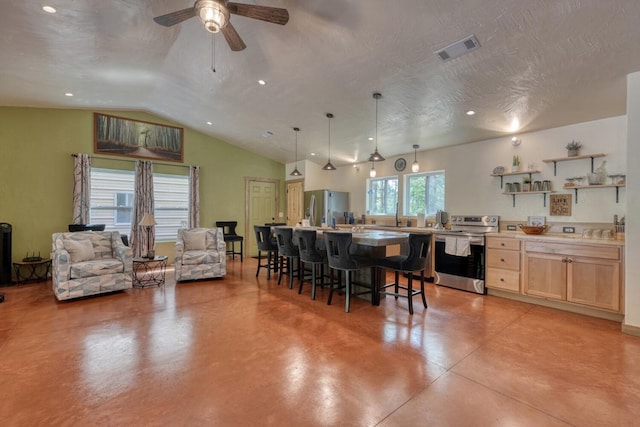 1529 Cedar View Ln, Hiawassee, GA 30546 - kitchen with appliances with stainless steel finishes, light brown cabinets, a kitchen breakfast bar, ceiling fan, and concrete floors