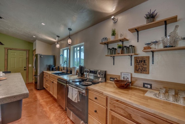 1529 Cedar View Ln, Hiawassee, GA 30546 - kitchen with appliances with stainless steel finishes, concrete floors, open shelves, vaulted ceiling, and butcher block counters