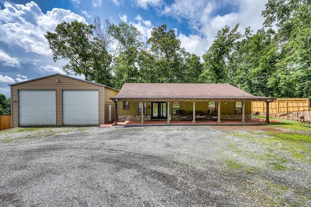 1529 Cedar View Ln, Hiawassee, GA 30546 - ranch-style home featuring covered porch, a detached garage, an outdoor structure, and roof with shingles