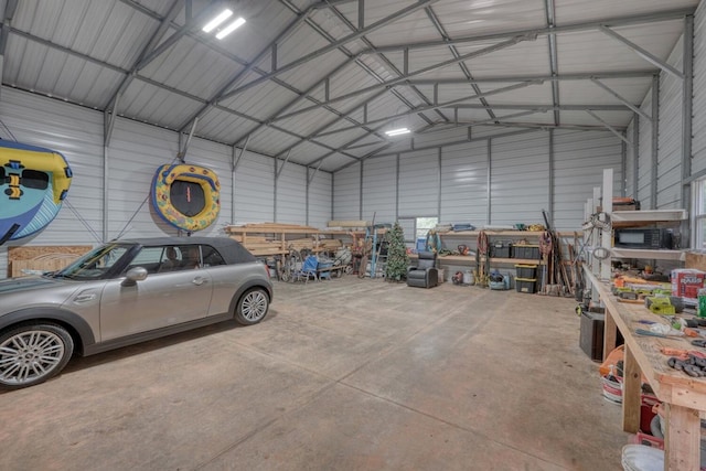 1529 Cedar View Ln, Hiawassee, GA 30546 - garage featuring metal wall and a workshop area