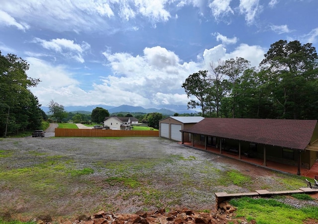 1529 Cedar View Ln, Hiawassee, GA 30546 - view of yard featuring a mountain view, an outdoor structure, and a garage