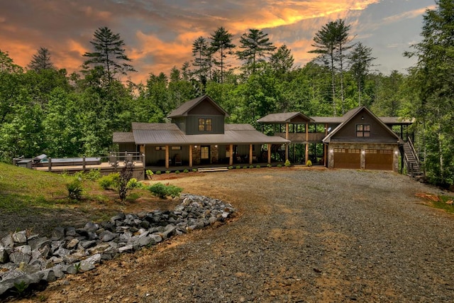 view of front of house with a garage and covered porch