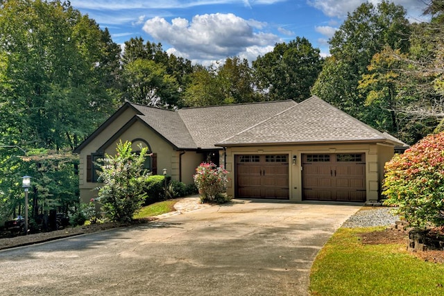 ranch-style home featuring a garage