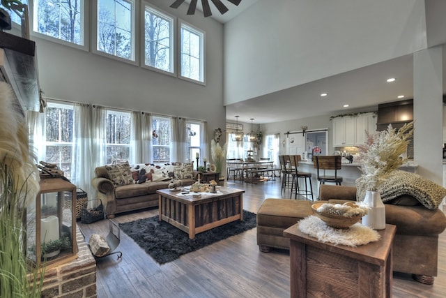 living room featuring hardwood / wood-style flooring and ceiling fan