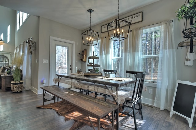 dining space with dark wood-type flooring