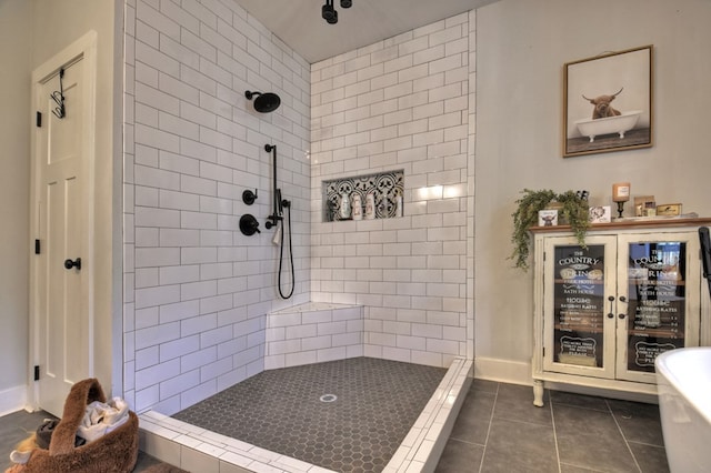 bathroom with tile patterned floors and tiled shower