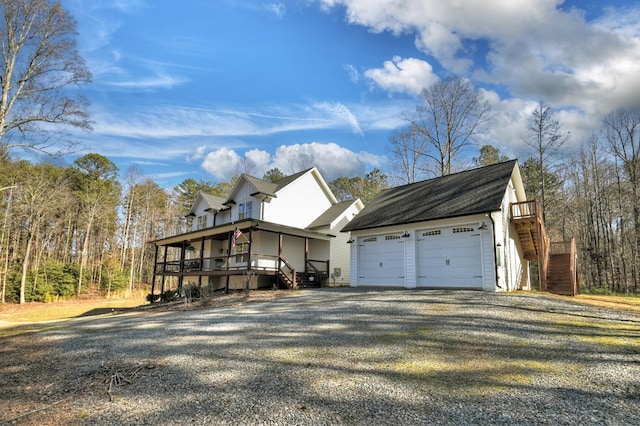 view of front of property with an outbuilding and a garage