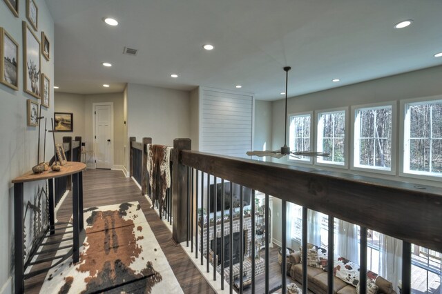 hallway with dark hardwood / wood-style floors