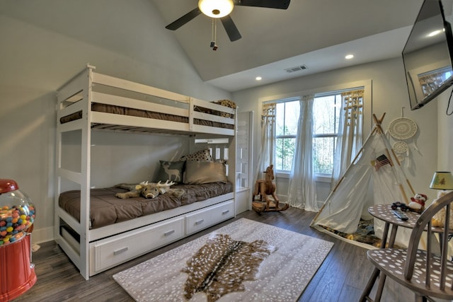 bedroom with dark wood-type flooring, ceiling fan, and vaulted ceiling