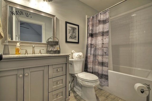 full bathroom featuring vanity, shower / bath combination with curtain, and toilet