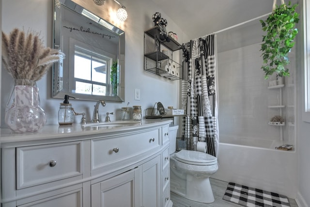 full bathroom with vanity, shower / tub combo, and toilet