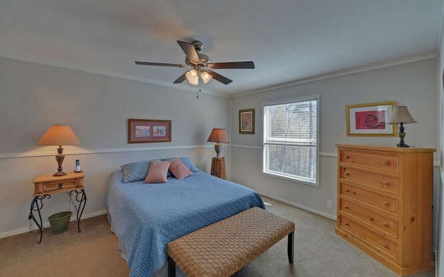 bedroom with ceiling fan, carpet floors, and baseboards