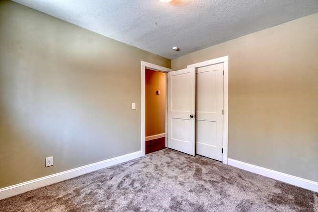 unfurnished bedroom with carpet