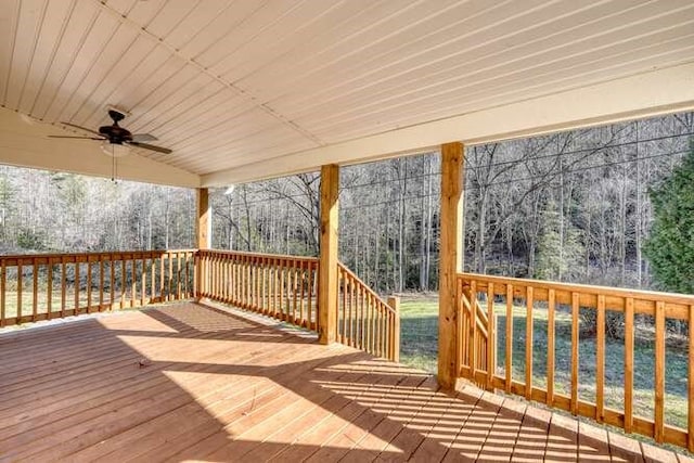 wooden terrace featuring ceiling fan