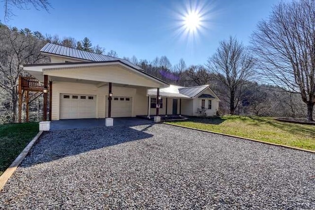 single story home with a garage and a front yard