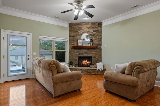 1726 Watercrest Way # B, Young Harris, GA 30582 - living room featuring ornamental molding, ceiling fan, a stone fireplace, and wood finished floors