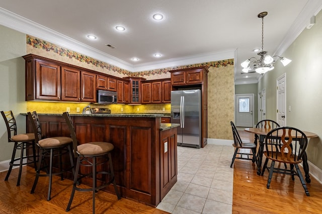 1726 Watercrest Way # B, Young Harris, GA 30582 - kitchen featuring stainless steel appliances, crown molding, a peninsula, glass insert cabinets, and baseboards
