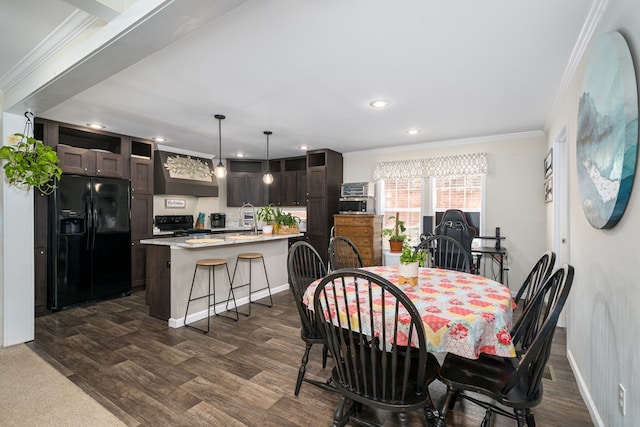 dining space with baseboards, recessed lighting, dark wood finished floors, and crown molding